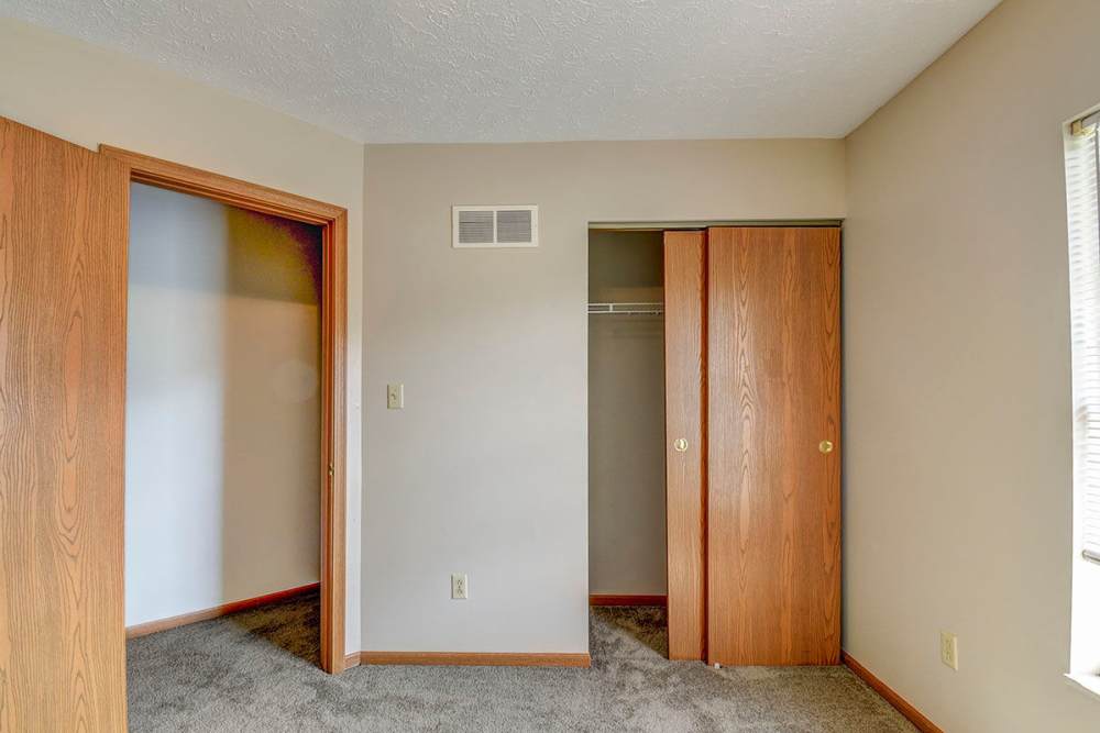 Bedroom with closet and carpet flooring at Greene Glen in Morgantown. WV