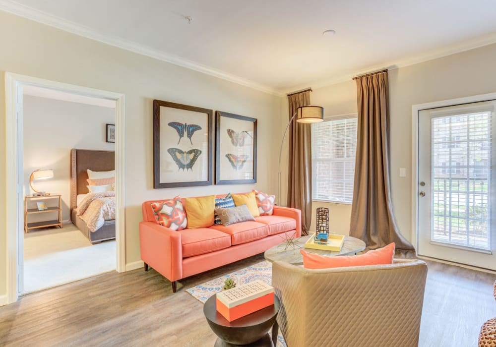 View of living area and bedroom at Bacarra Apartments in Raleigh, North Carolina