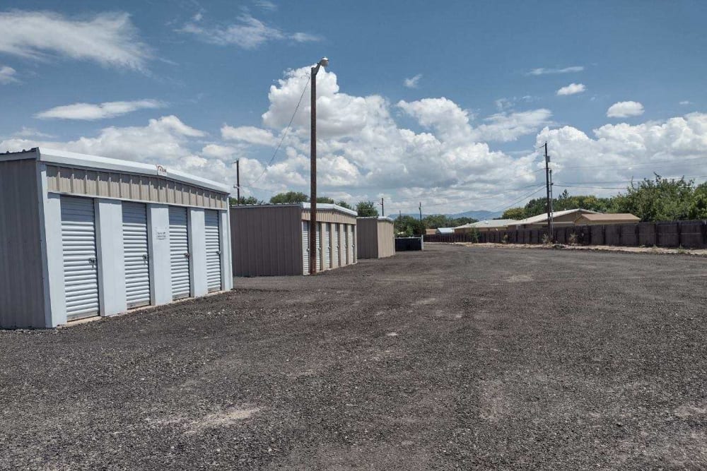 Wide driveways between drive-up storage units at Valencia Storage & MHP in Los Lunas, New Mexico