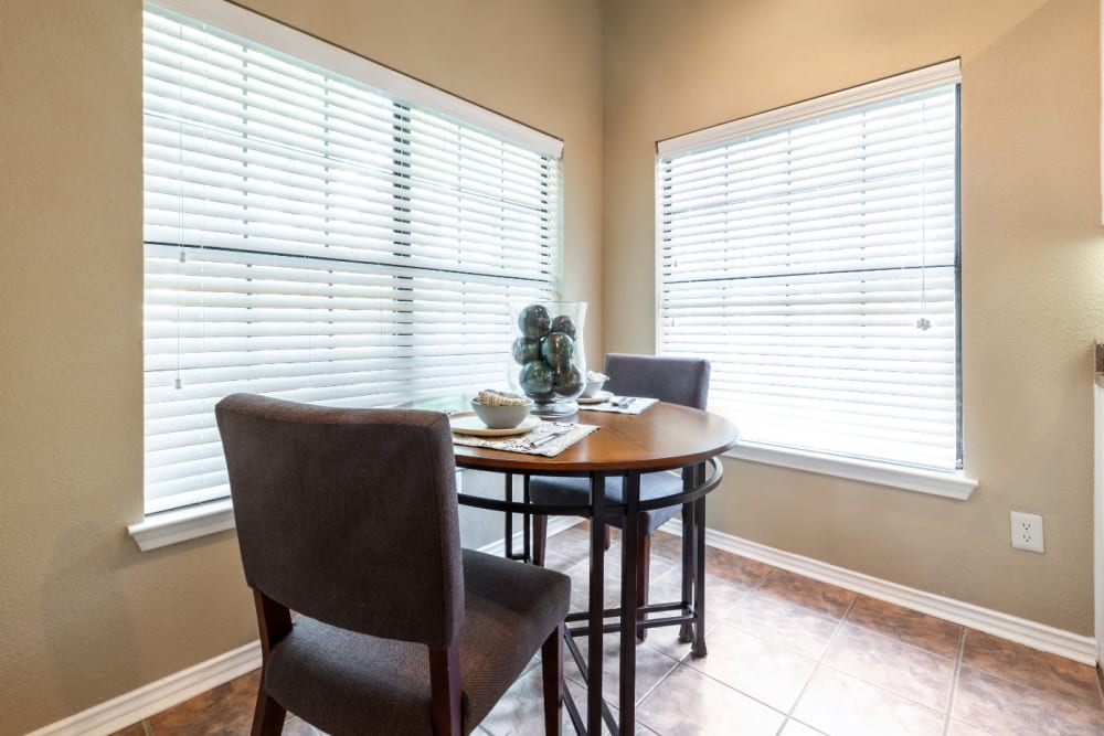 Dining corner of kitchen area with large windows at Marquis at Waterview in Richardson, Texas