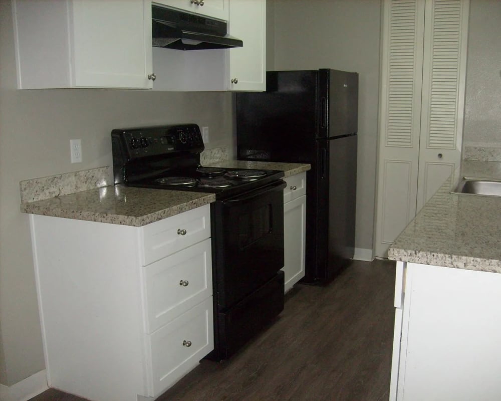 Kitchen with black appliances at  Park Place Apartments in Roseville, California