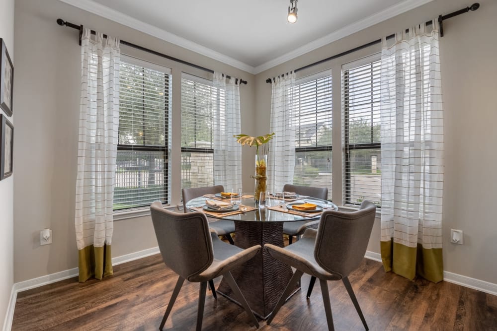 Bright dining area with large windows at Marquis at Sugar Land in Sugar Land, Texas