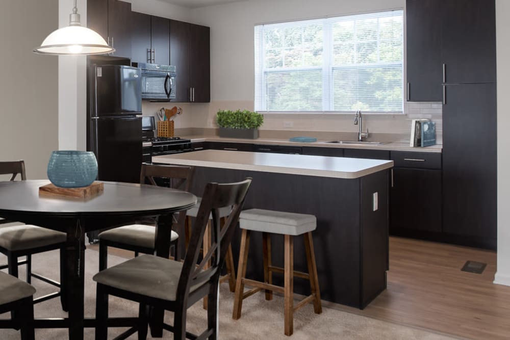 Kitchen with a kitchen island at The Grove Somerset in Somerset, New Jersey