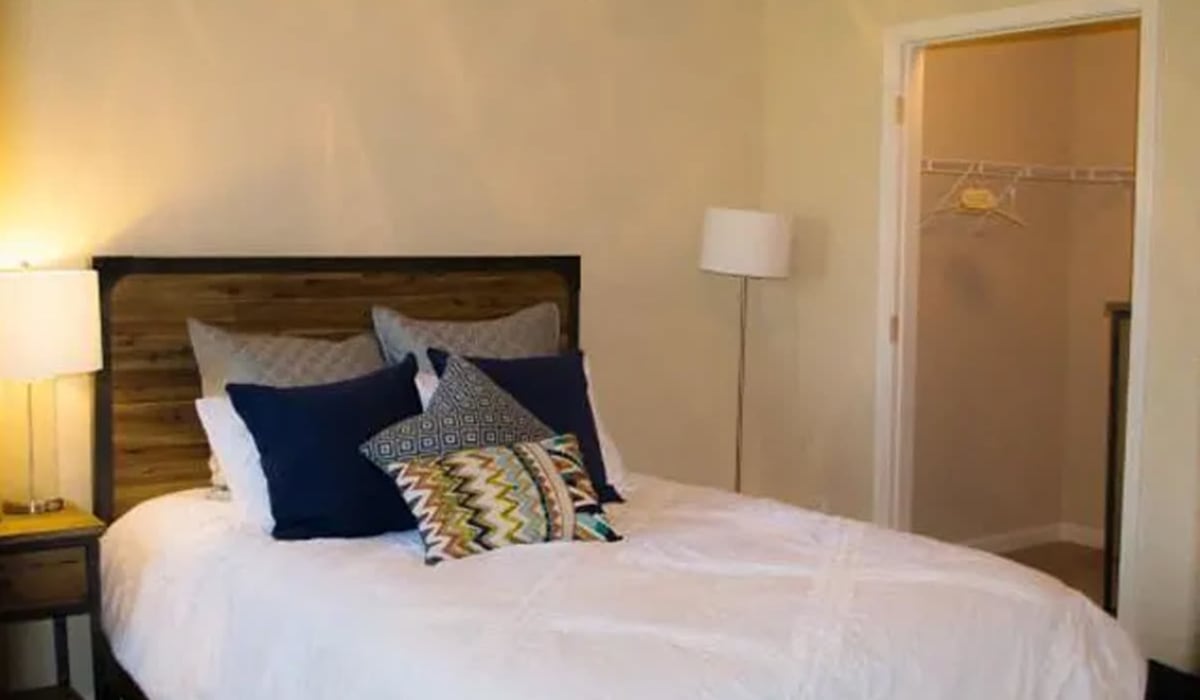 Bedroom with bed and closet at Siena Villas Apartments in Elk Grove, California