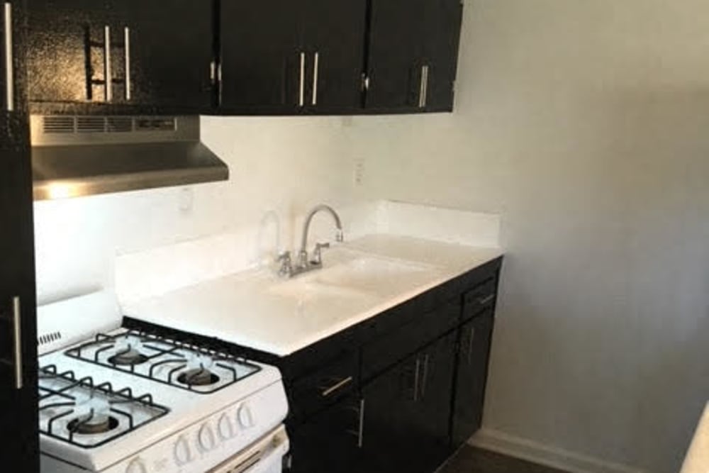 Modern kitchen with dark brown cabinets at  Occidental in Oxnard, California