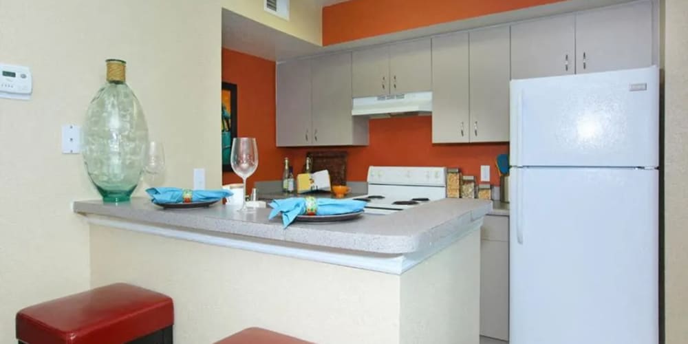 Bar seating in an apartment kitchen at Vero Green in Vero Beach, Florida at Vero Green in Vero Beach, Florida