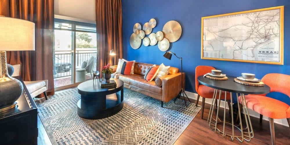 Model home's living room with accent wall at Switchyard in Carrollton, Texas