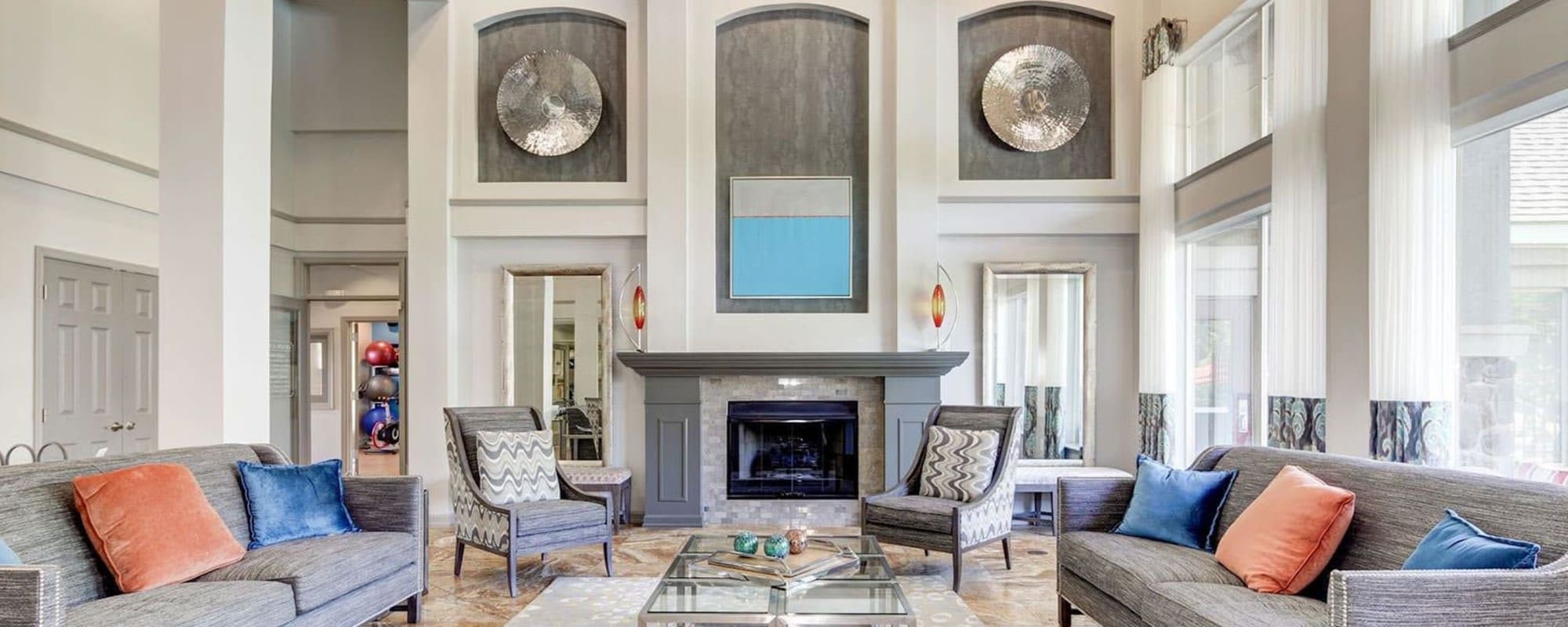 Fireside seating in the clubhouse at The Courts of Avalon in Pikesville, Maryland