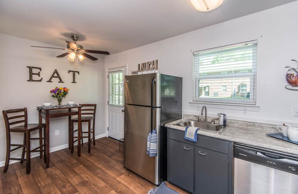 Cozy dining space featuring modern kitchen appliances and decor at Avian Place Apartments in North Charleston, South Carolina
