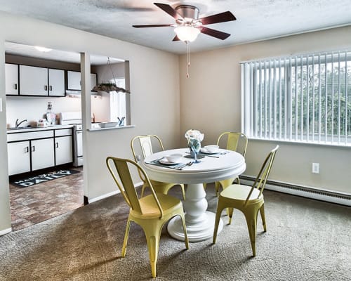 Dining area with a ceiling fan at Park Place of South Park in South Park, Pennsylvania