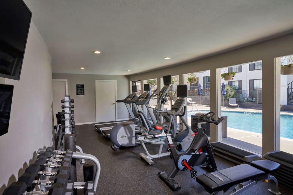 free weights and cardio equipment in fitness center at The Fountains of Preston Hollow in Dallas, Texas