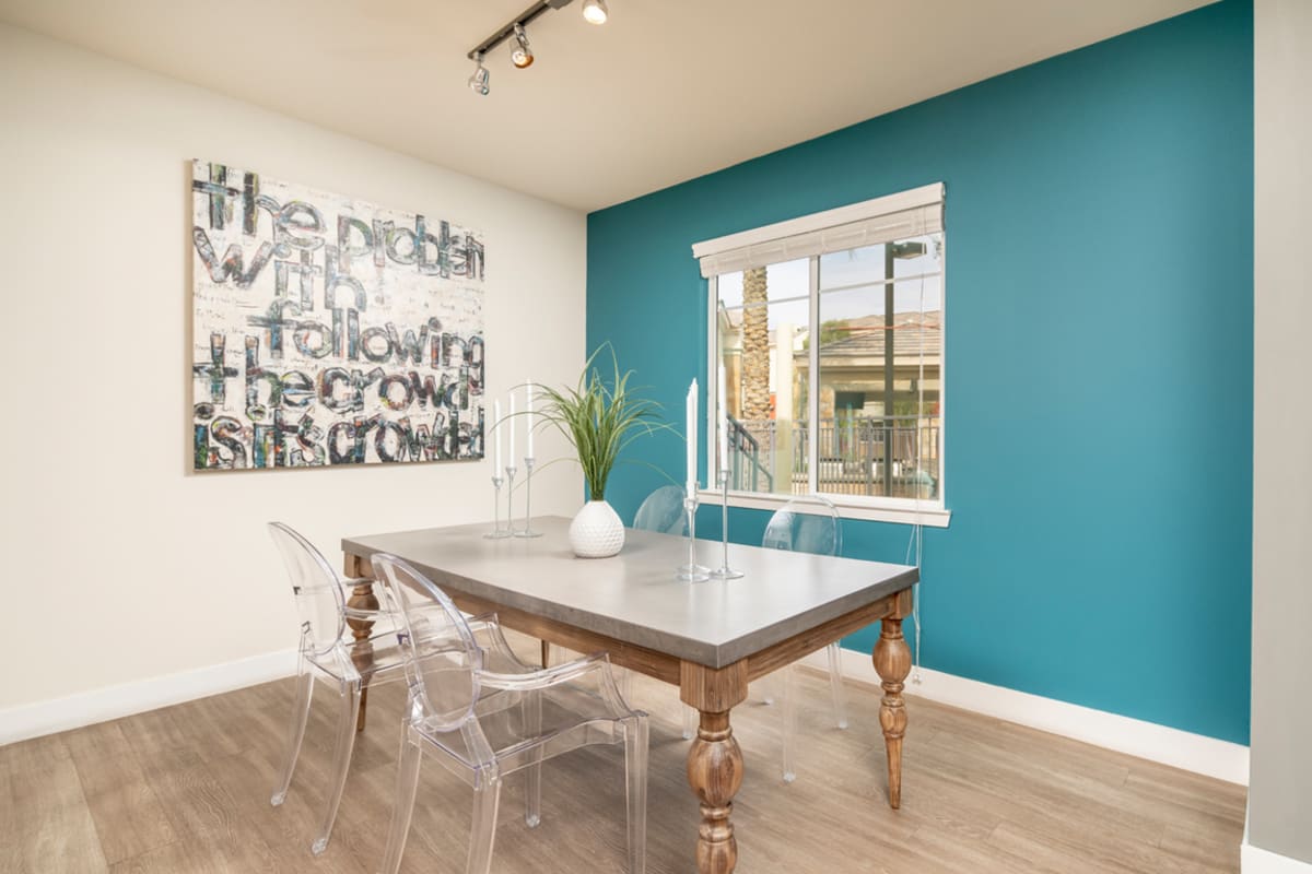 A table and chairs in an apartment at Volta on Broadway, Tempe, Arizona