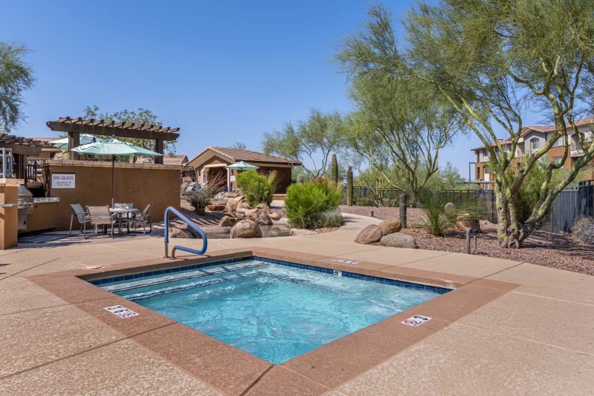Hot tub next to community BBQ area at Marquis at Sonoran Preserve in Phoenix, Arizona