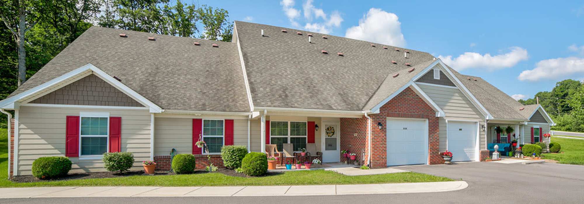 Exterior view of homes on a sunny day at Braddocks Greene in Frostburg, Maryland