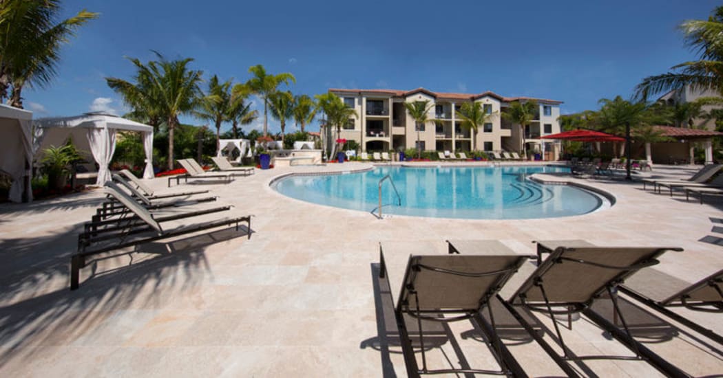 Beautiful swimming pool area at Town Fontainebleau Lakes Apartment Residences in Miami, Florida