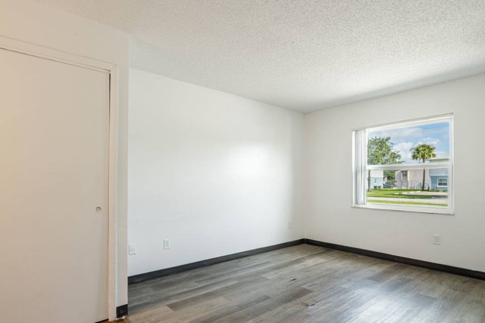Bedroom with window at Dunwoodie Place in Orlando, Florida