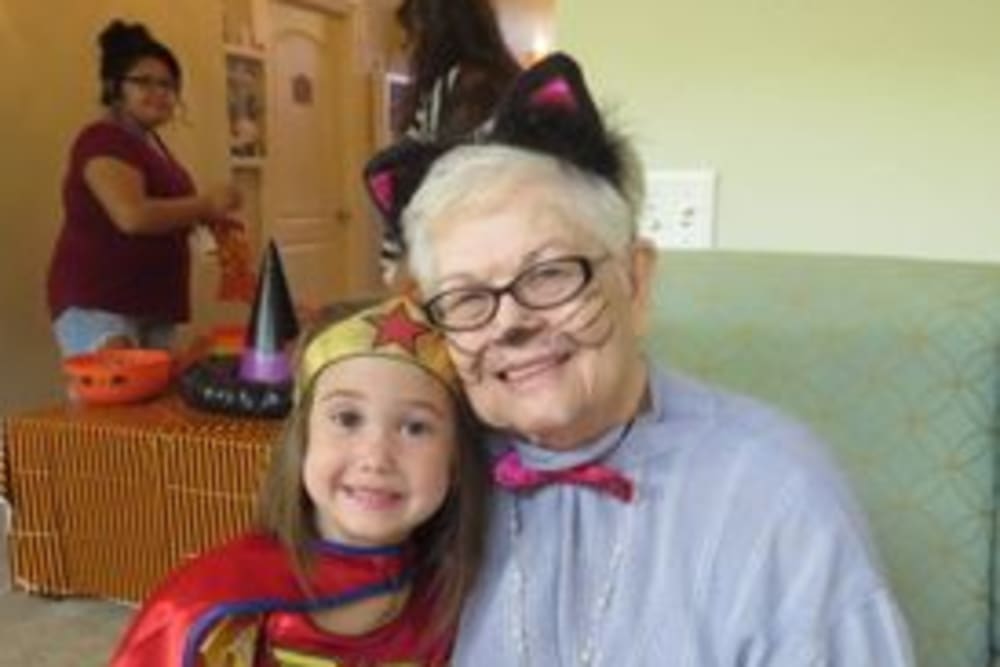 Residents petting ponies at Shawnee Memory Care in Shawnee, Oklahoma