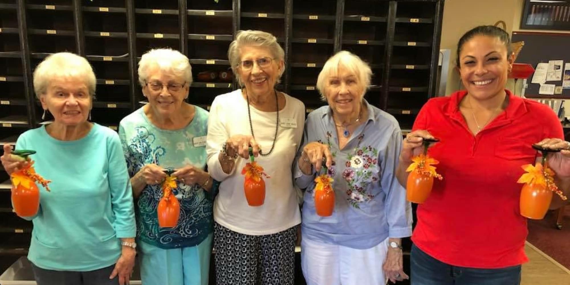 A group of residents with decorated cups at Parker Place in Mentor, Ohio
