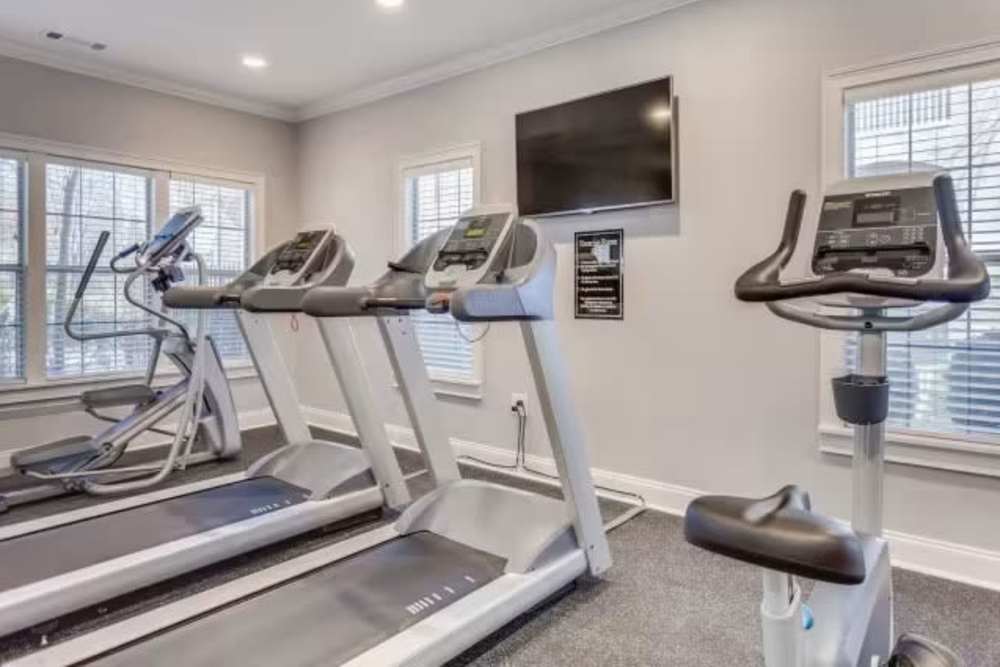 Fitness center with tread mills at Arbors at Fairview Apartments in Simpsonville, South Carolina