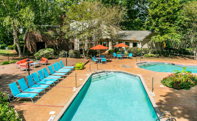 Two swimming pools and lounge chairs at The Waterford Apartments in Columbia, South Carolina