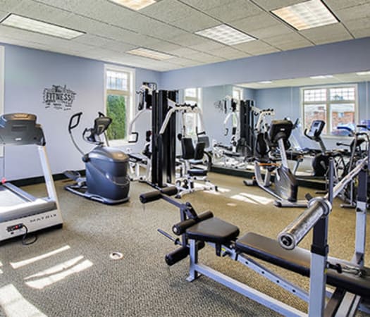 Fully-equipped fitness center at Knollwood Manor Apartments in Fairport, New York