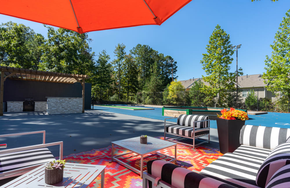 Lounge chairs by the pool at The Hundred Exchange in Fayetteville, Georgia