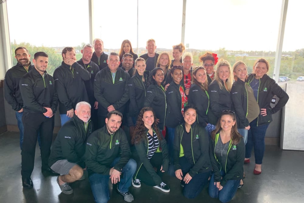 Group of staff in matching jackets at Inspired Living in Ocoee, Florida.