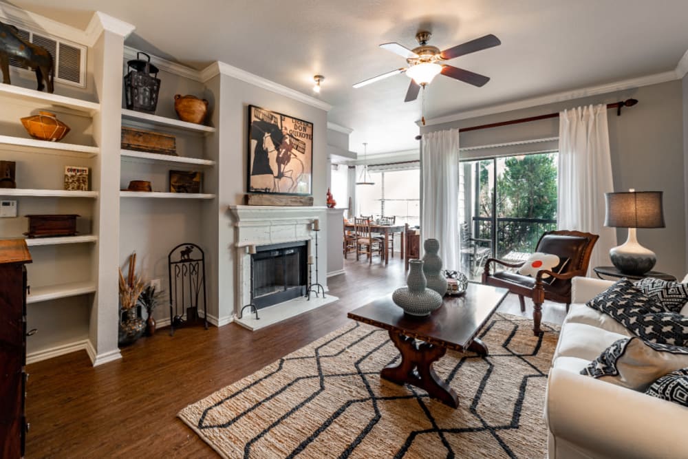 Spacious living area with wood style flooring at Marquis at Lantana in Flower Mound, Texas