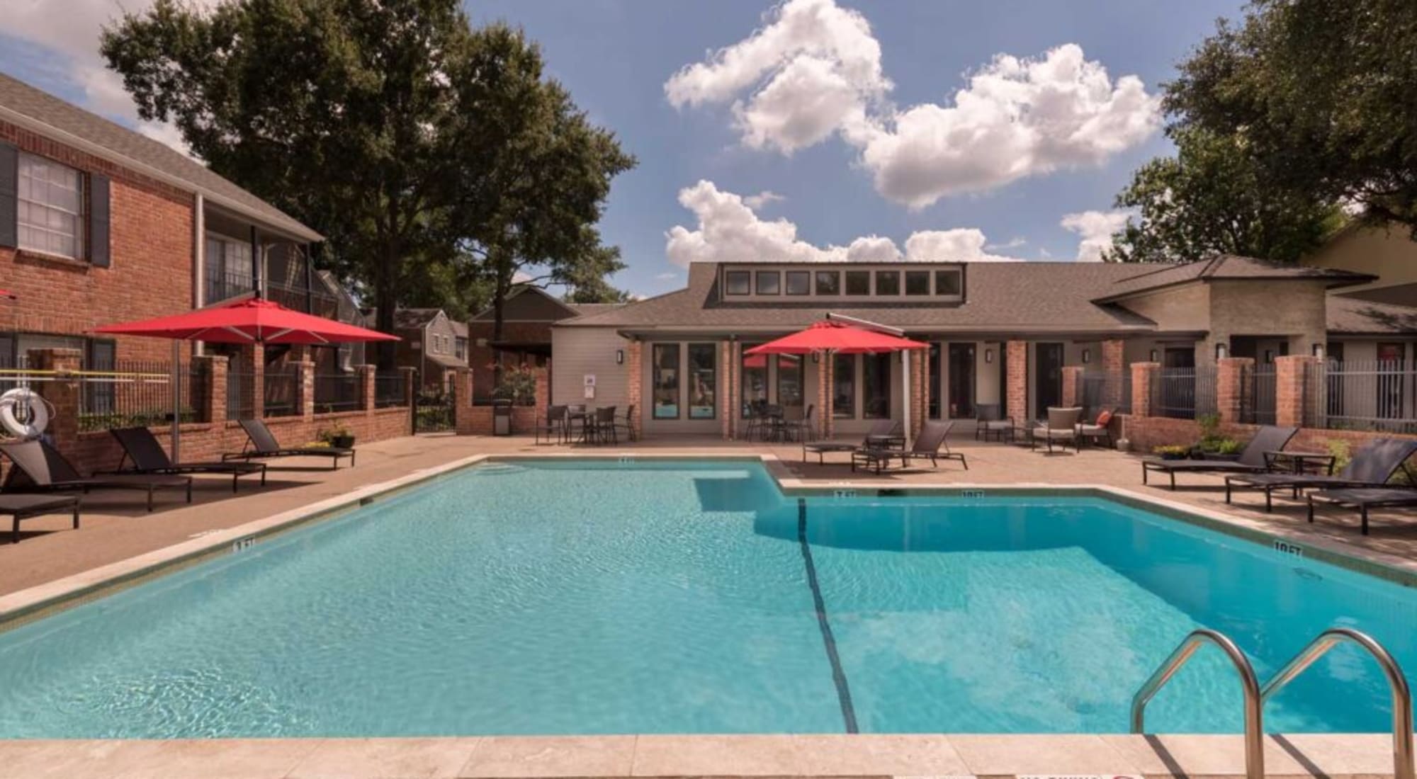 Pool with lounge chairs at Vintage at 18th Street in Houston, Texas