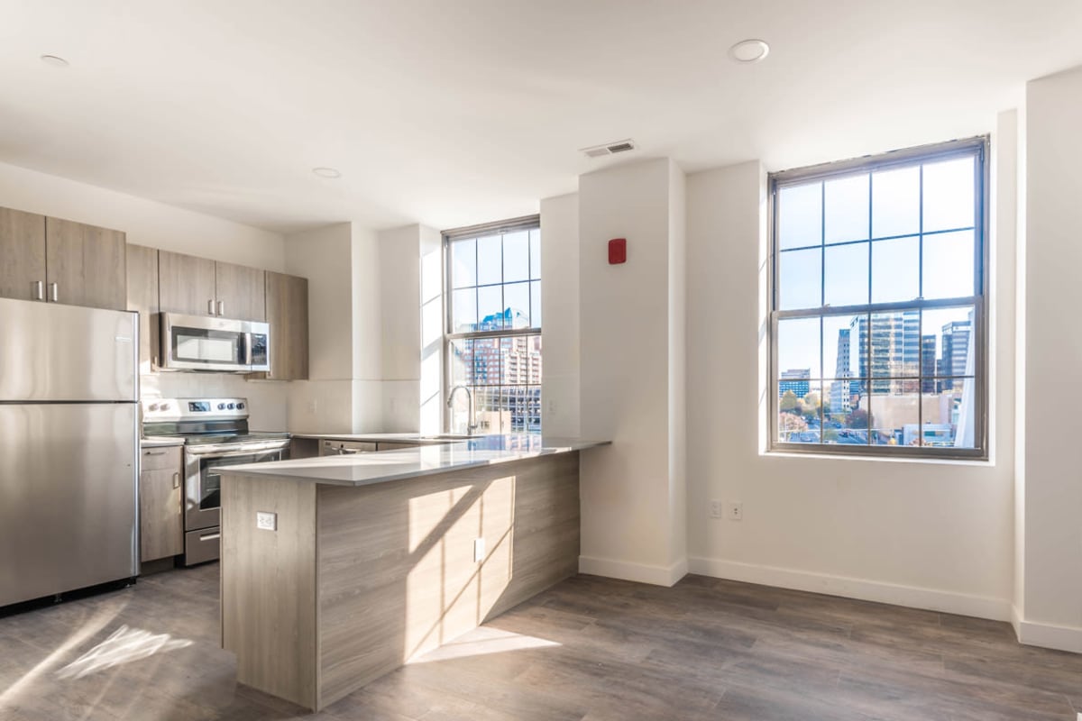 Living room and apartment kitchen at The One Atlantic in Stamford, Connecticut