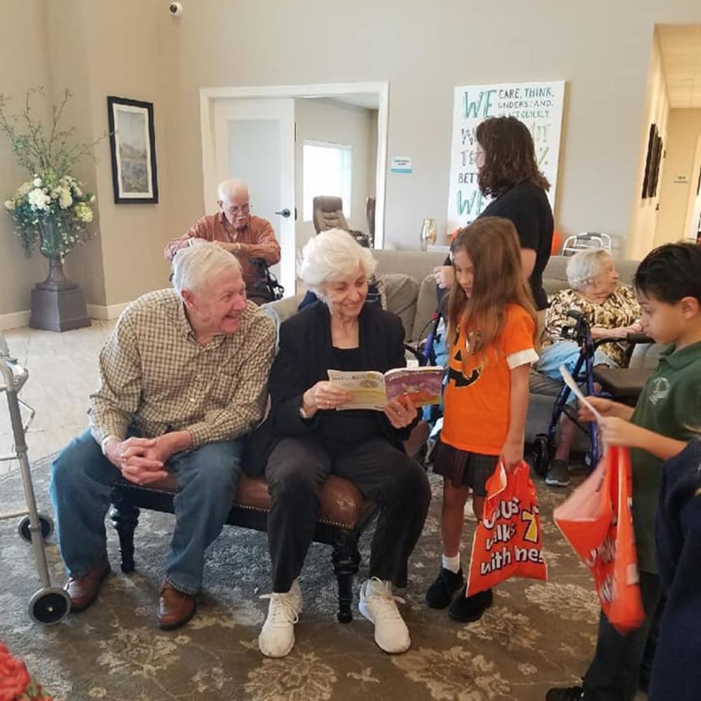 Residents having Halloween fun with kids at Inspired Living Kenner in Kenner, Louisiana.