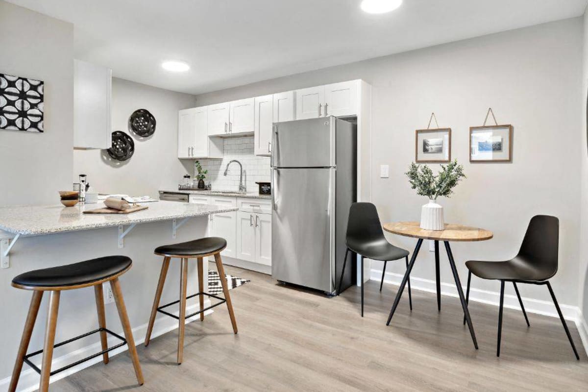 Dining area and kitchen in an apartment at Addison at Princeton Meadows in Plainsboro Township, New Jersey