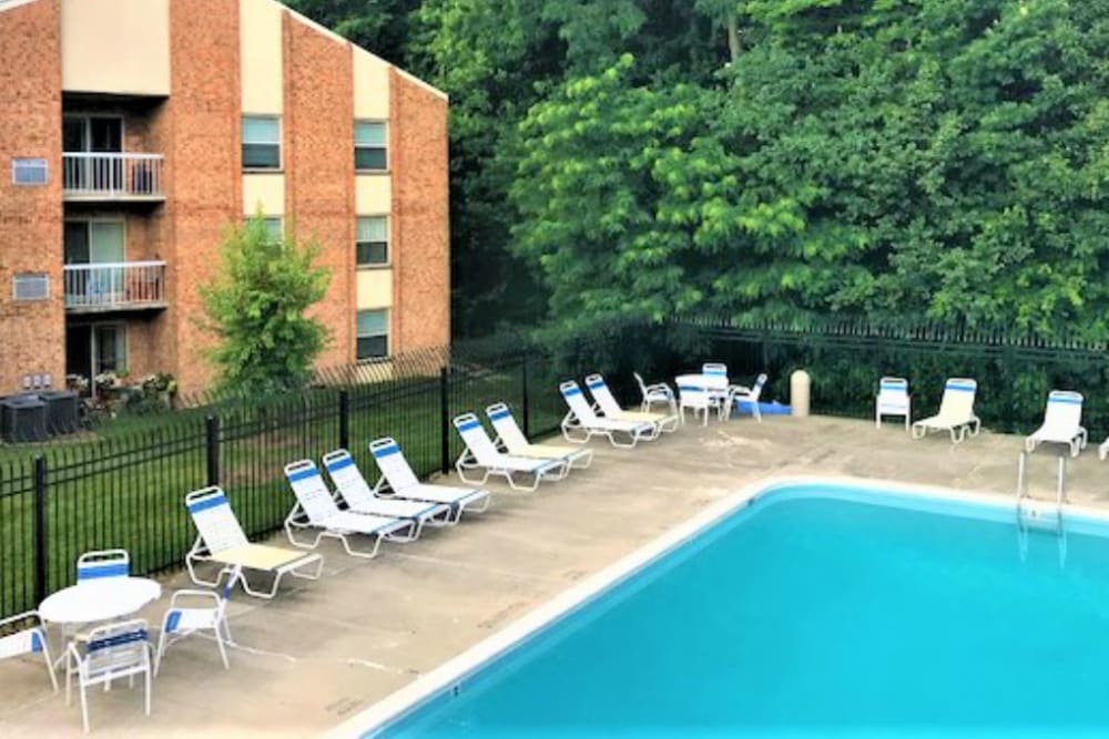 Swimming pool with lounge chairs at Creekside Village in Alexandria, Virginia