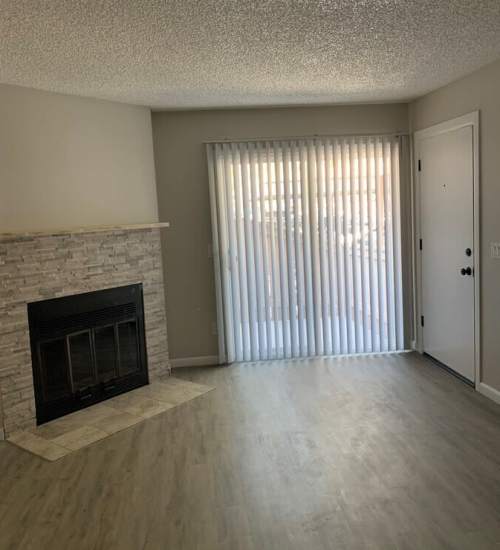 Living room with fireplace at Oak Hill in Escondido, California
