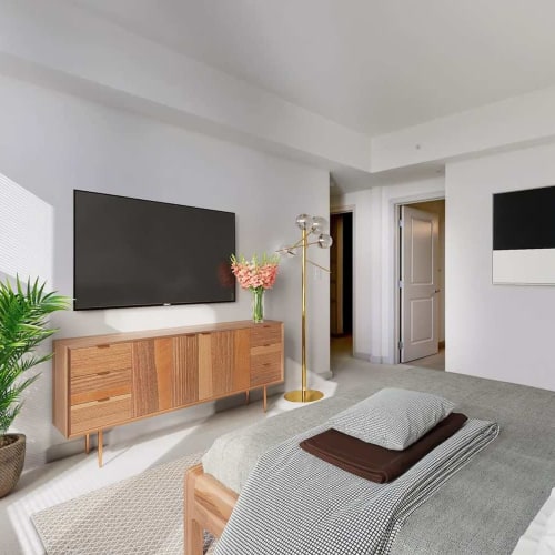 Bedroom with television at Solaire 7077 Woodmont in Bethesda, Maryland