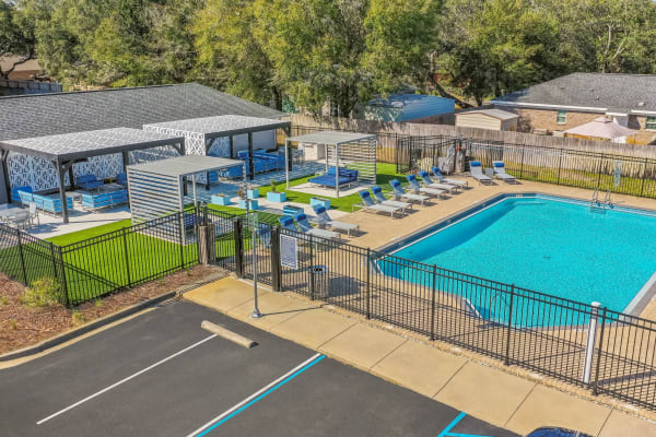 Aerial shot of pool area with outside seating area at The Aria in Fort Walton Beach, Florida