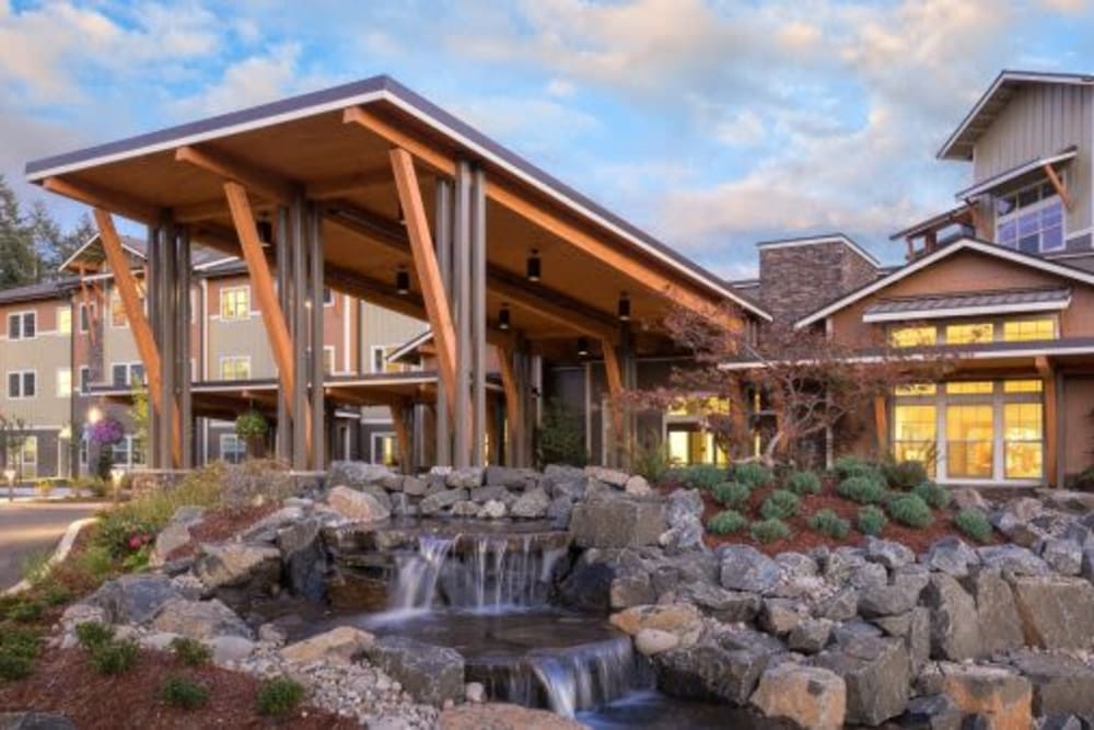 Entry way with beautiful waterfall in The Springs at Greer Gardens at Eugene, Oregon