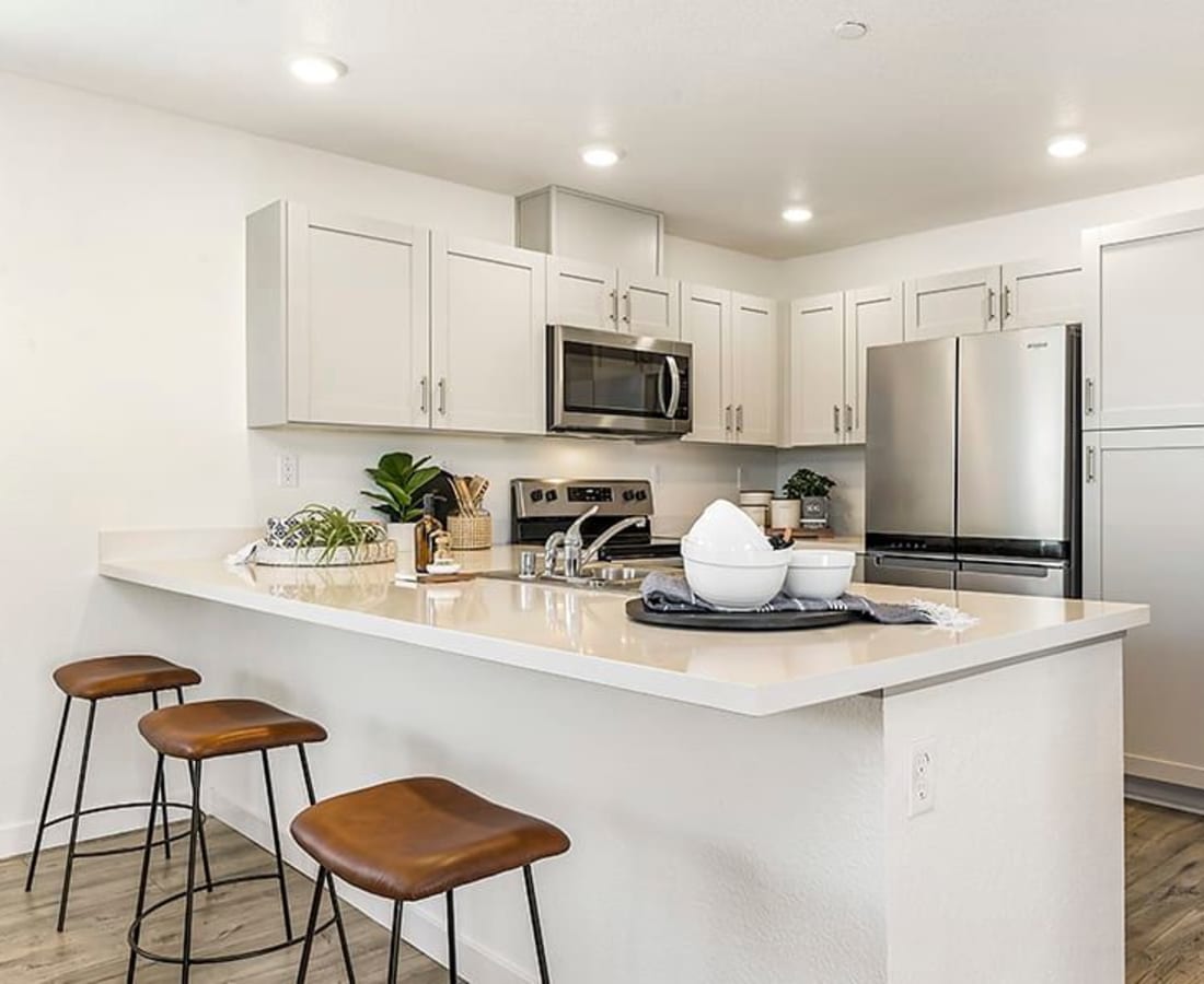 Kitchen with counter stools at Isles in Roseville, California