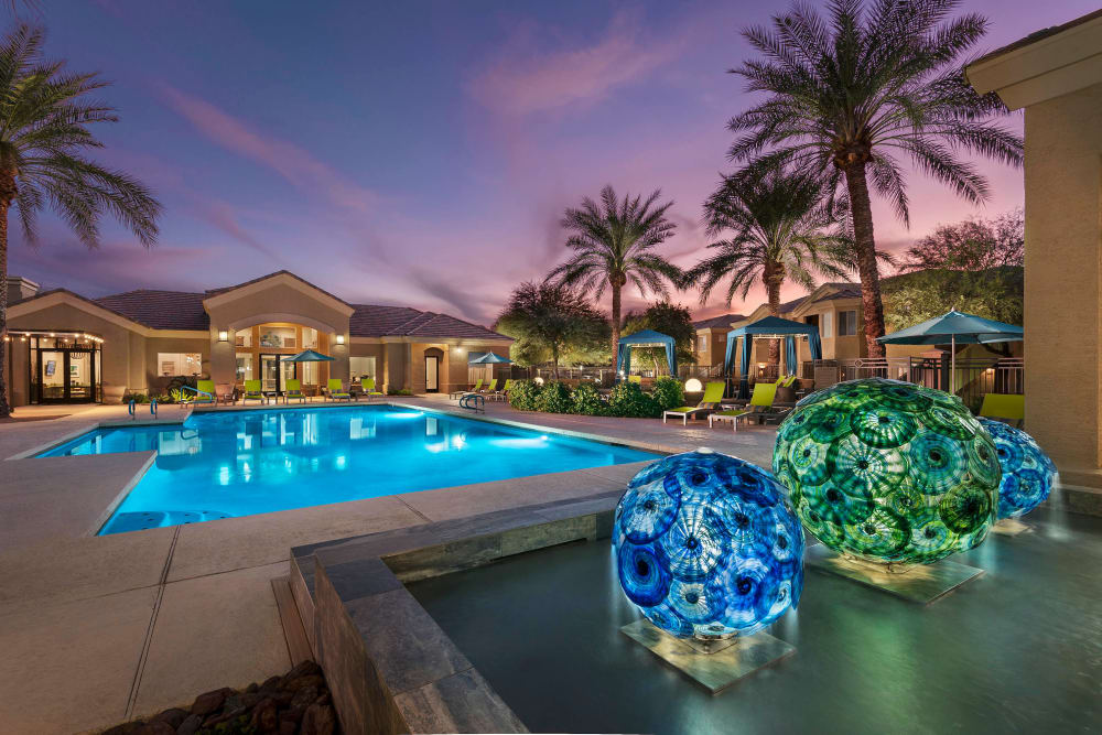 Beautiful swimming pool at dusk at Mira Santi in Chandler, Arizona