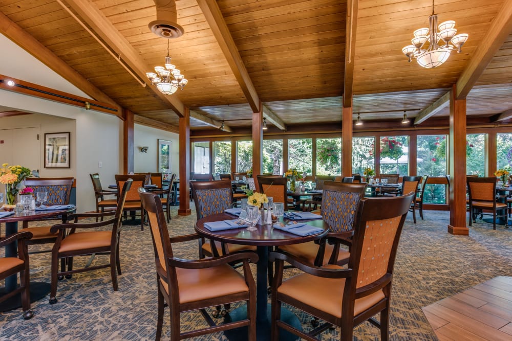 Vaulted ceilings and large windows in dining area at The Firs in Olympia, Washington