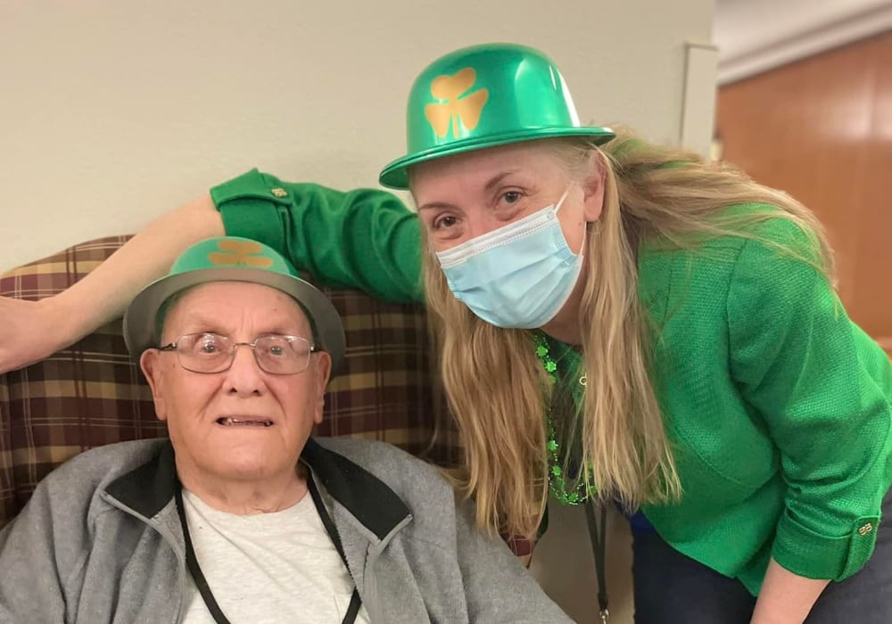 Resident and caregiver dressed for St. Patrick's Day at Bell Tower Residence Assisted Living in Merrill, Wisconsin