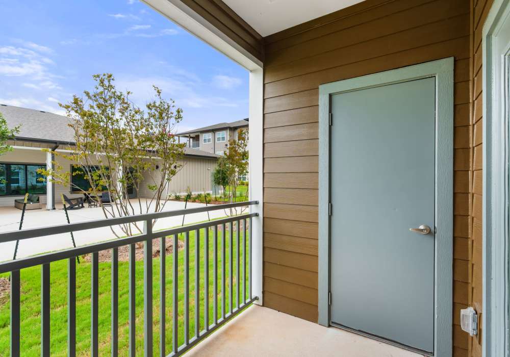 Covered balcony with storage access at Walnut Springs in Seguin, Texas