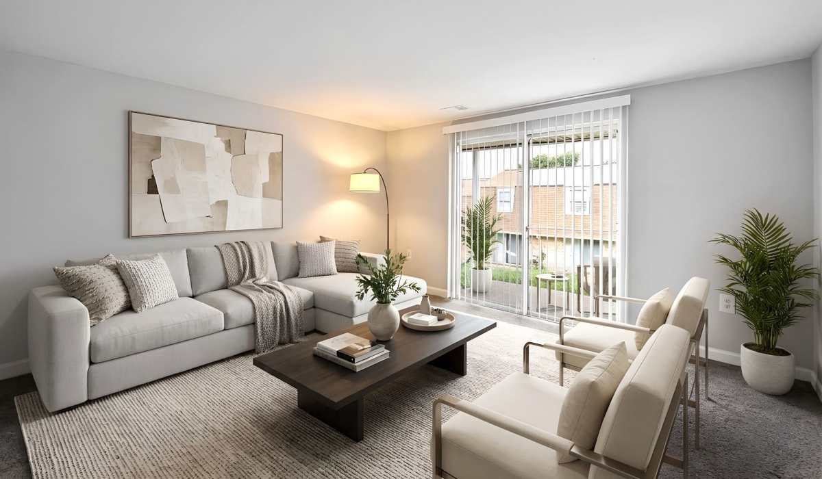 Modern living room with glass door at Pleasant View Townhomes in Baltimore, Maryland
