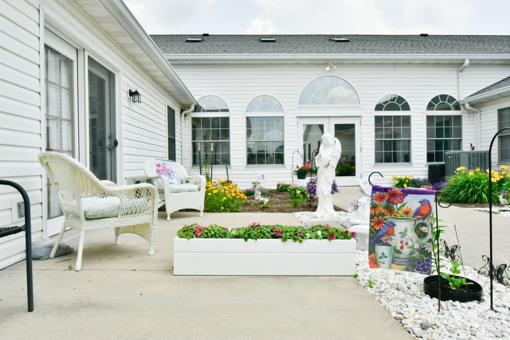 Courtyard with statues and flowers at Garden Place Red Bud in Red Bud, Illinois