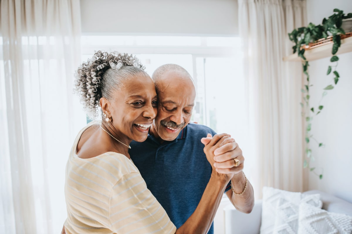 Couple Happily Dancing at Oxford Glen Memory Care at Carrollton in Carrollton, Texas