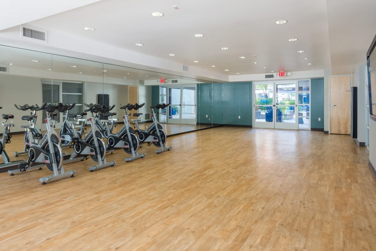Fitness center with wood floor at The Howard, Glendale, California