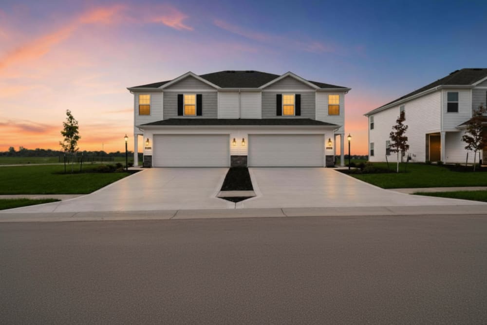 Two attached homes in sunset lighting at Brixin Sonora in Fort Wayne, Indiana
