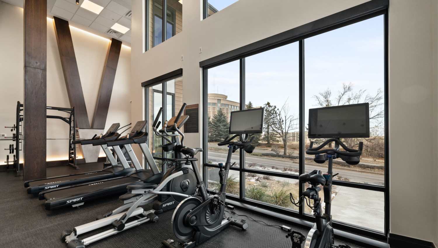Well-equipped fitness center with treadmills at The Lock at Flatirons in Broomfield, Colorado