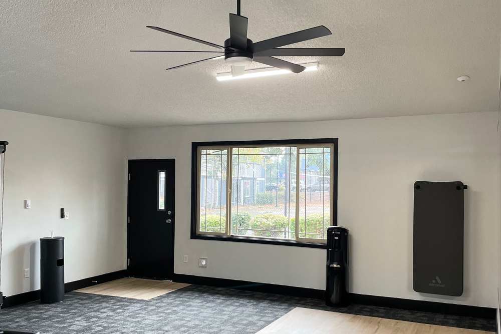 Well-lit fitness center at The Village at SoTa in Tacoma, Washington