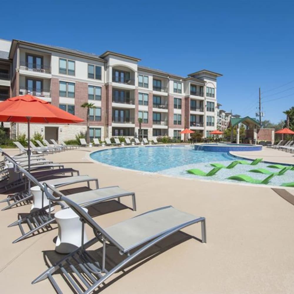 Swimming pool with sundeck at Imperial Lofts in Sugar Land, Texas